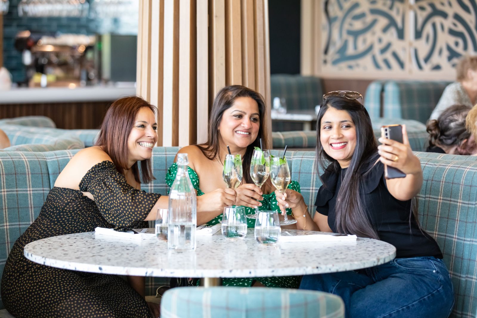 Friends enjoying drinks at Script restaurant