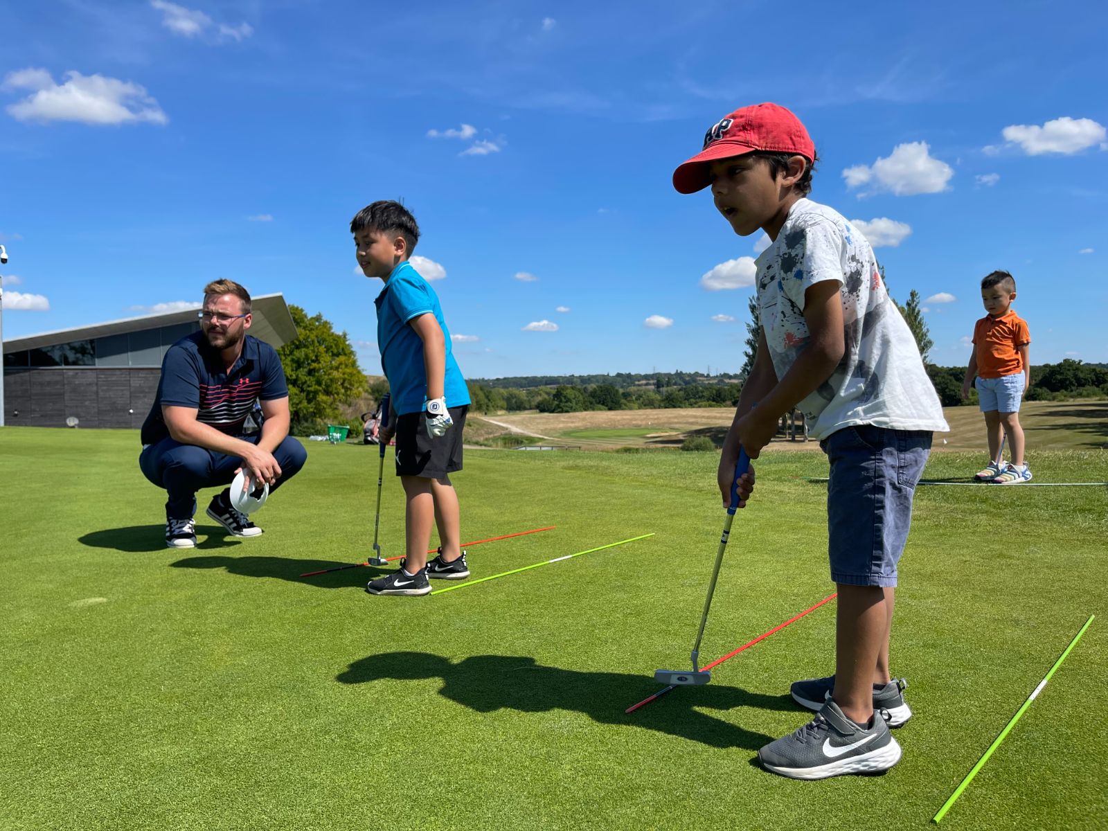 Children at a putting clinic with the pro
