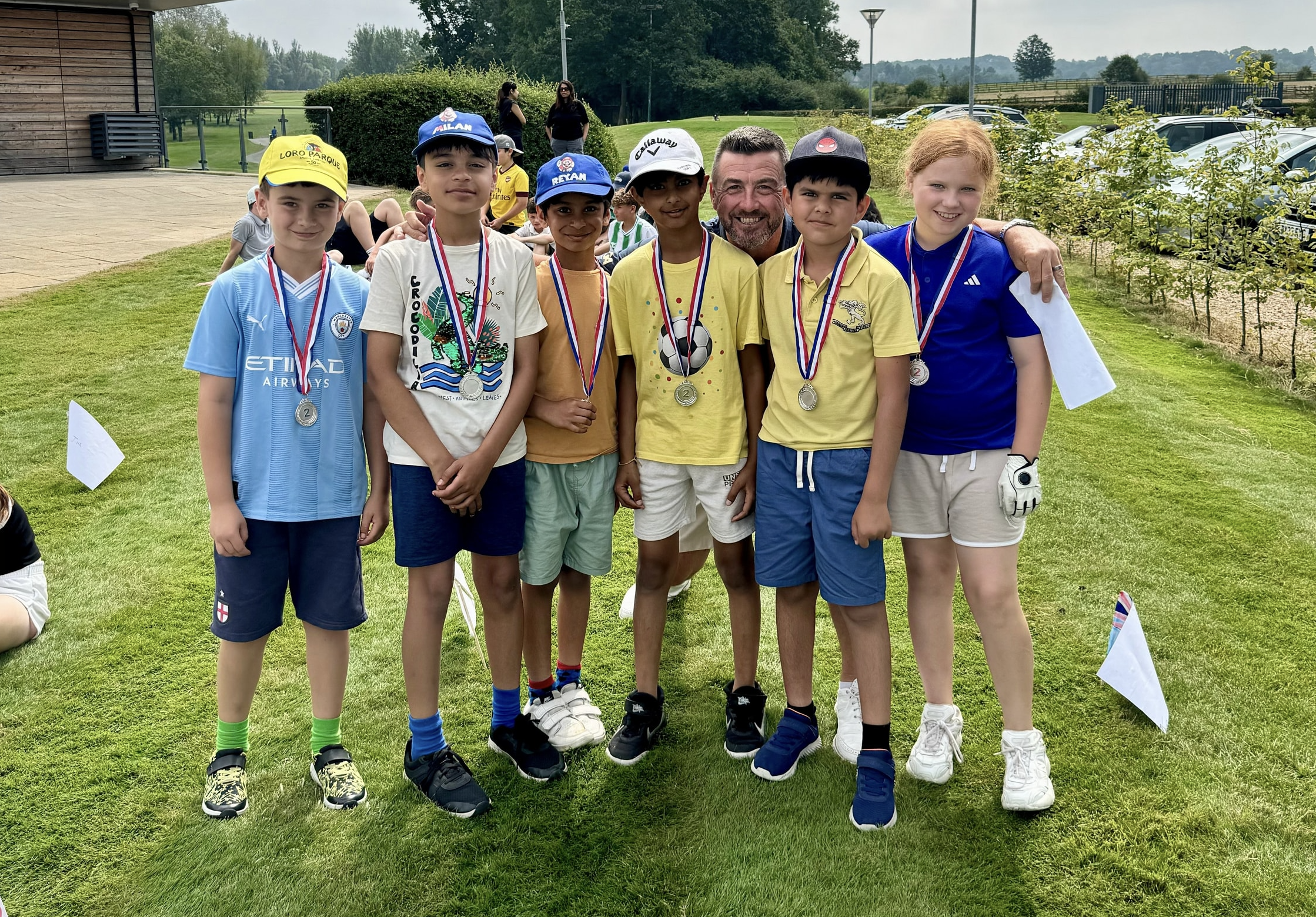 Junior medal winners with the pro